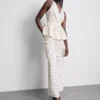Peplum-Top mit Neckholder und Polka-Dots